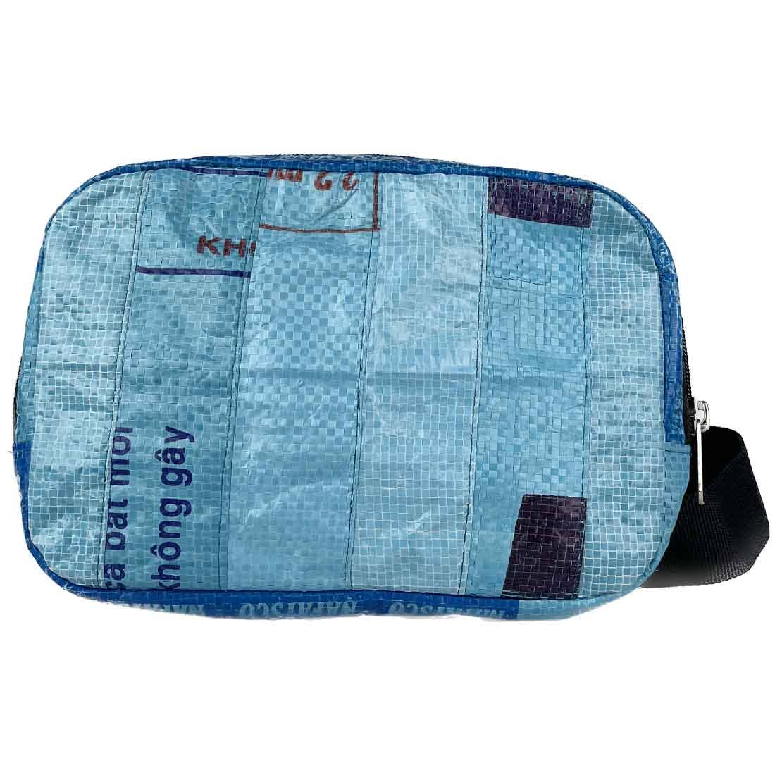 Blue patchwork pouch with text on a white background