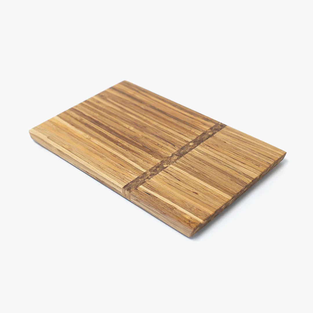 Wooden charcuterie board made from chopsticks on a white background